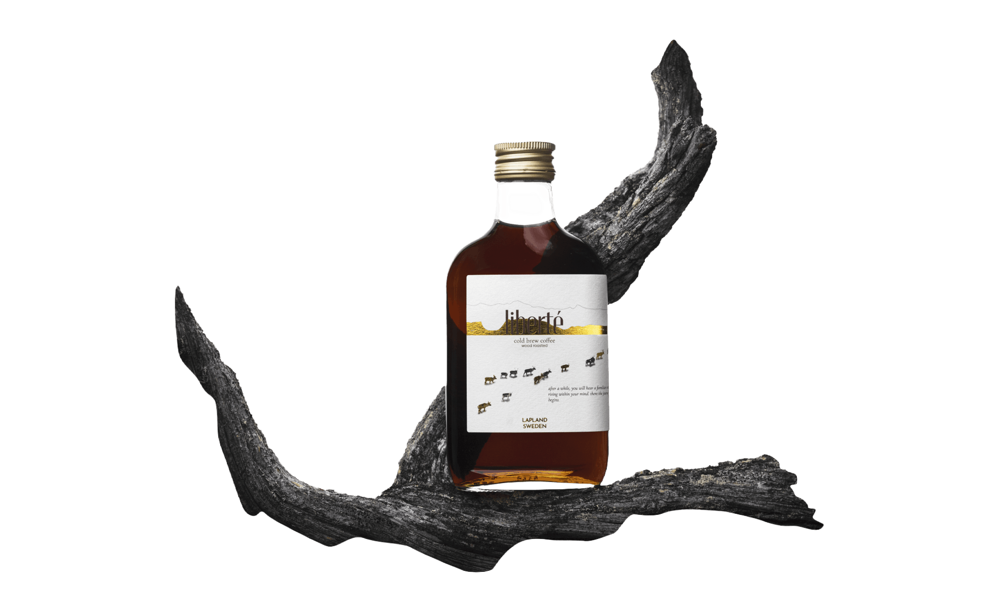 Liberté bottle on driftwood